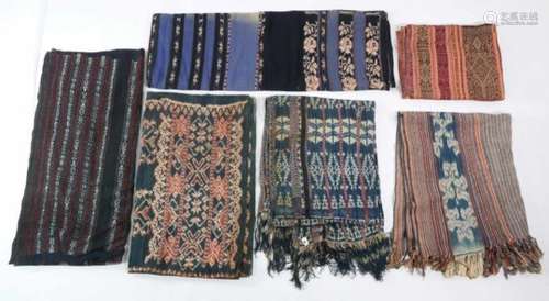 Indonesia, a collection of nine Ikat textilesvarious designs, some damaged, worn or faded, retrieved