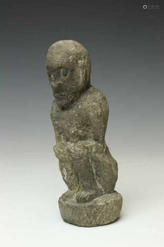 Indonesia, carved vulcano stone figure,squating figure with hands on knees. Provenance, Indonesian