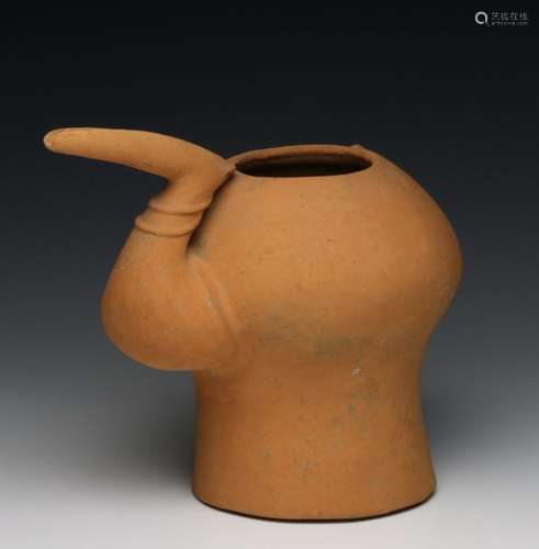 Persia, red terracotta jug, 1st Mil. BC,with a fine ridge over the back and a bent sprout in the