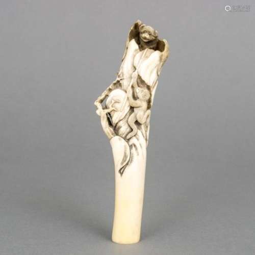 Stag antler handle: a rocky surface with a monkey climbing up towards a bat, Japan, not signed,