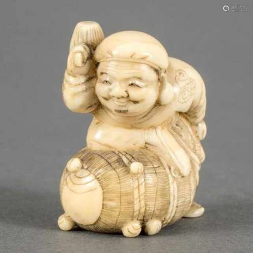 Walrus ivory netsuke: Daikokuten with a mallet in his hand, standing on a bale of rice, Japan, not