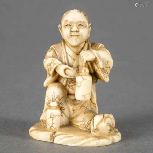 Small ivory okimono: sitting man with a flask, Japan, signed Yoshimasa and with kakihan, second half