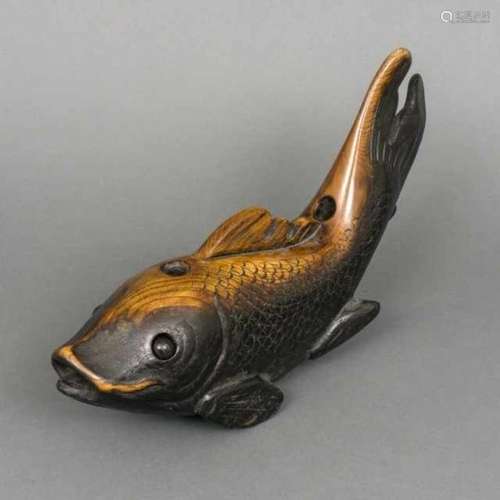 Wooden yokogi shaped like a koi, the eyes can move in their sockets, the yokogi is part of a