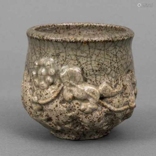 Sôma ware chawan with craqueled grey glaze and brown specks, the high relief decoration depicts a