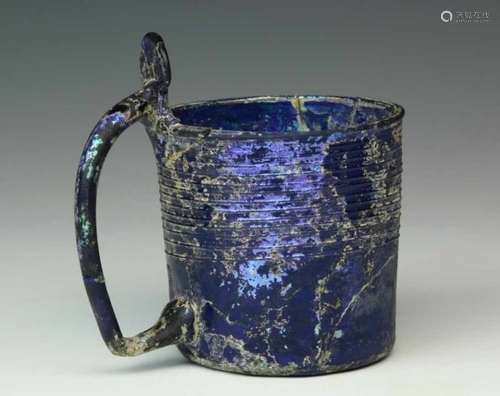 Persia or Syria, rare blue glass beaker, 10th-12th centurywith ribs and a handle.; h. 10,4 and diam.