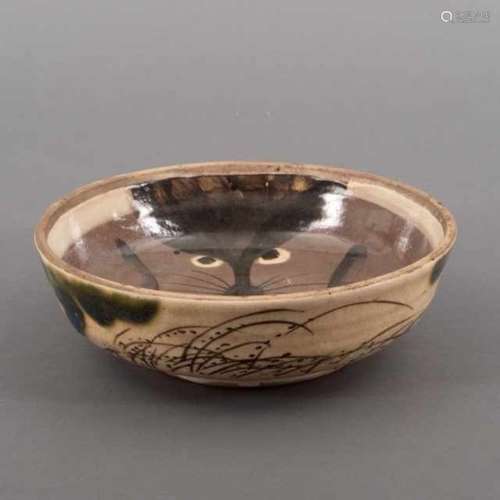 Ao-Oribe ware bowl, the inside decorated with a tanuki motif, the outside decorated with a grass