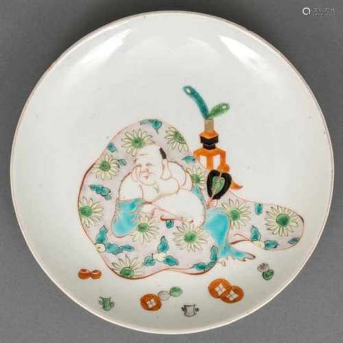 Porcelain plate with famille verte decoration of Hotei lying down on his bag and with a Chinese-