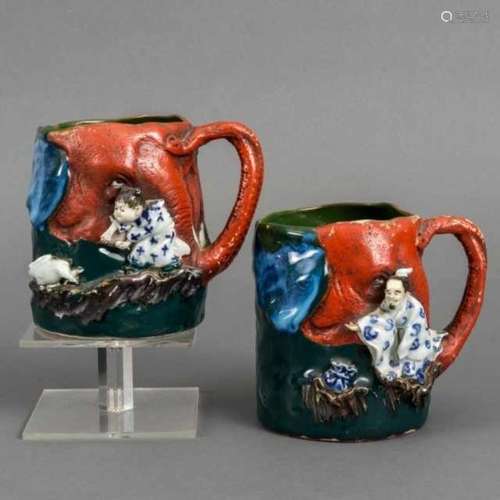 Pair of Sumida ware tankards with high relief: a karako chasing a white rabbit, and a man with a