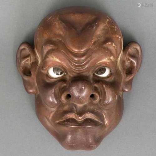 Red lacquer iki-ningyô mask with facial hair, the upward-looking eyes inlaid with glass: