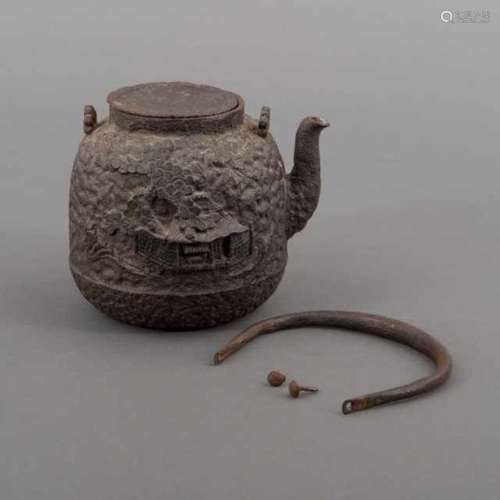 Cast iron tetsubin with a high relief of a house underneath a pinetree, with knobless lid, Japan,