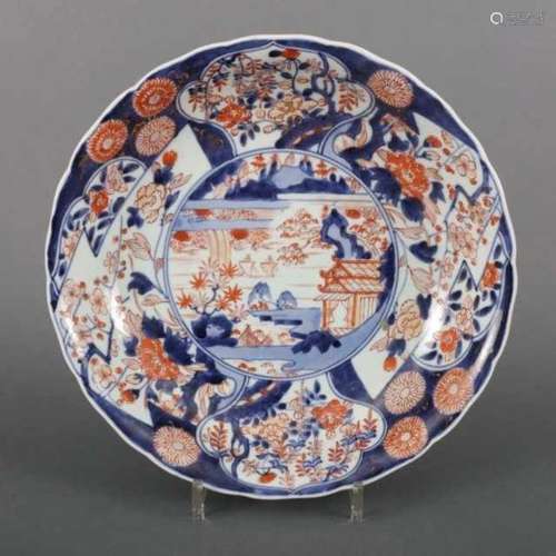 Imari porcelain deep dish decorated with a landscape, the border with flowers, Japan, 18th