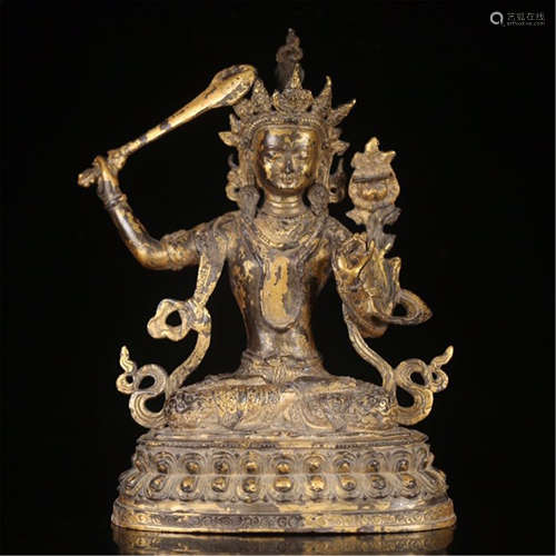 TIBETAN GILT BRONZE SEATED BUDDHIST GUARDIAN