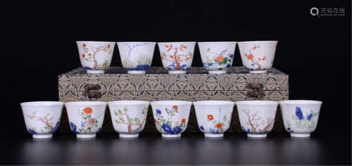 TWEELVE CHINESE PORCELAIN BLUE AND WHITE FAMILLE ROSE CUPS