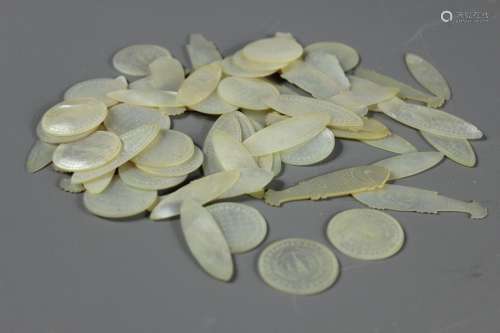 A Quantity of Japanese Mother of Pearl Counters, including fifteen fish, twenty one disc-shape and twenty six oblong