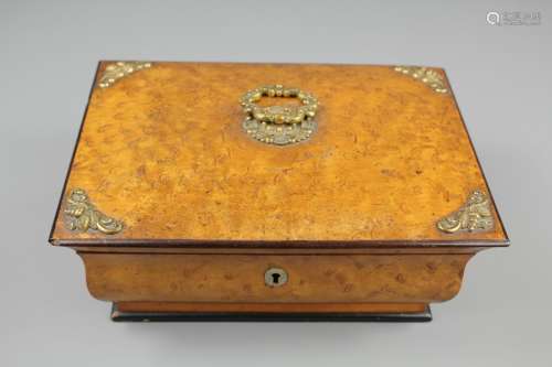 An Early 19th Century Palais Royale Burr Maple Sewing Box/Necessaire; the box having ormolu mounts with ring top handle