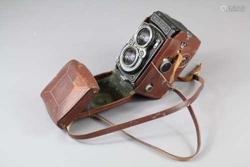 A Franke & Heidecke Rolleiflex Camera; Synchro Compur, Tessar 1:2-8 f = 80 mm nr 571874, in the original brown leather case, made in Germany