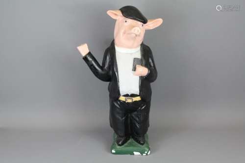 A Plaster Figure of a Butcher's Pig; the pig dressed in a vicar's outfit, approx55 cms h