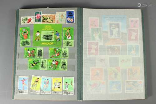 Several Albums of Communist-bloc Stamps; together with an album of GB First Day Covers and a hardback book