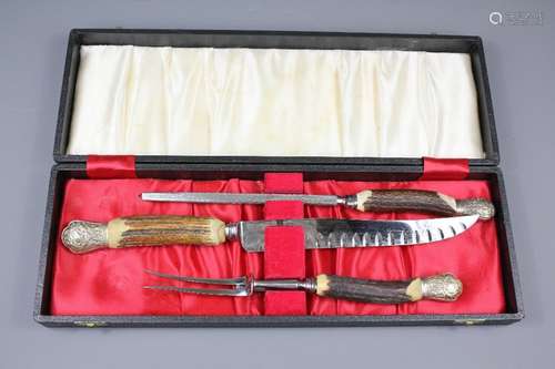 An Antler Handled Cooper Bros & Sons Ltd Carving Set; comprising carving knife, fork and steel, in the original presentation