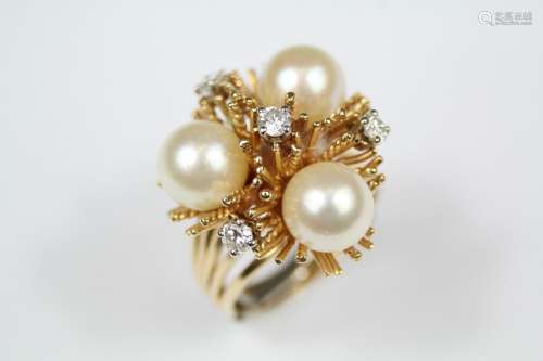 A Lady's 14ct Yellow Gold Stylistic Diamond and Pearl Ring, size L/M (with sizing band), set with four brilliant-cut satellite-mounted diamonds approx 36 pts and three 8mm, pearls mounted on a wire nest