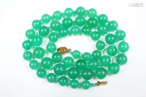 A Chinese Green Agate Necklace, suspended from a silver clasp, approx 62 cms, approx beads measure approx 7mm to 11mm