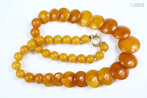 Butterscotch Amber Necklace, approx 40 cms, the amber set with circular 8mm beads and the flat buttons range from approx 10 x 20mm, approx 37