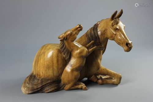 African Matabele Light Wood Carving of a Mare; the resting mare accompanied by her playful, rearing foul, approx 46 x 35 x 28 cms