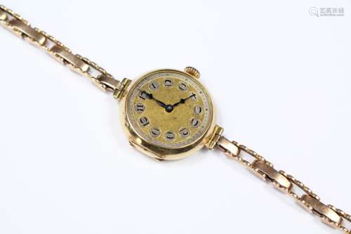 A Lady's 9ct Gold Cocktail Watch, having a numeric dial, on a 9ct gold strap, gross weight approx 36