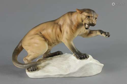 Beswick Pottery Snarling Mountain Lion; the lion on a rocky outcrop base, approx 30 cms w x 21 cms h