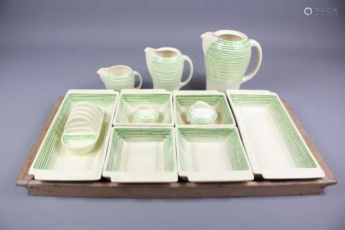 Susie Cooper Part Coffee Set; the set decorated with green and black stripes comprises a coffee pot, hot water pot with lid, milk jug, toast rack and an hors  d'oeuvres set comprising two rectangular dishes approx 25 x 11 cms, four square dishes approx 12 x 11 cms