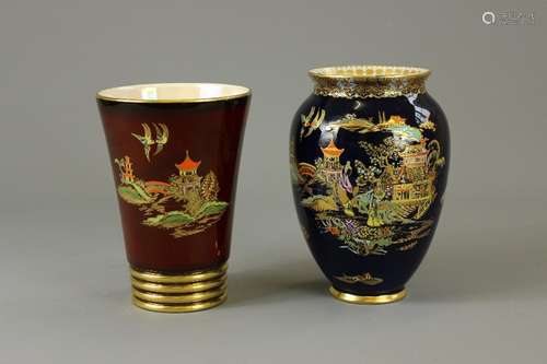 Two Carlton-Ware Mikado Vases; the first Rouge Royale depicting a temple scene with gilt ringed pattern to base, approx 16 cms h, the companion Blue Mikado depicting a temple scene with gilt decoration to rim, approx 18 cms h