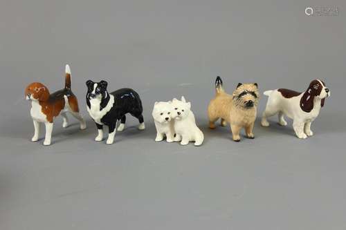 Five Beswick Dog Figurines; this lot includes a Beagle approx 8 x 9 cms, Spaniel approx 10 x 8 cms, Border Collie approx 10 x 8 cms, Highland Terrier approx 8 x 7 cms and two other Terriers approx 7 x 6 cms