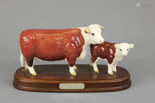 A Beswick Hereford Cow and Calf Figurine, entitled 