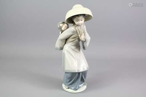 Lladro Figurine of a Chinese Mother and Infant, approx 31 cms h, impressed marks to base 5100, in the original presentation box