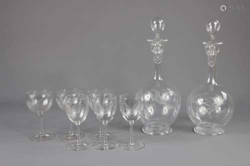 A Collection of Vintage Glass; the collection comprises two decanters, fifteen white wine glasses and five port glasses, each glass and decanter acid etched with birds in flight (22)