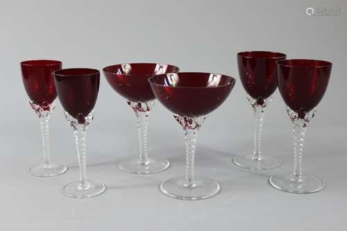 A Quantity of Cranberry Glass; the collection comprises five champagne, five white wine, three sherry glasses and a brandy goblet