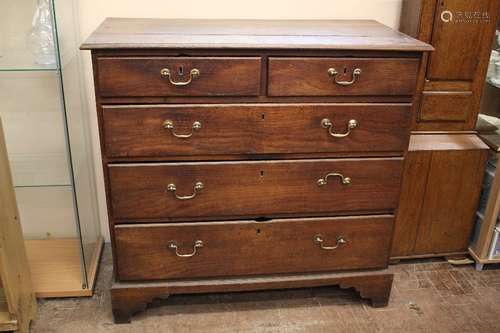 A Georgian Oak Chest of Drawers; the chest having two short drawers and three long drawers, on bracket feet, approx 99 x 50 x 95 cms