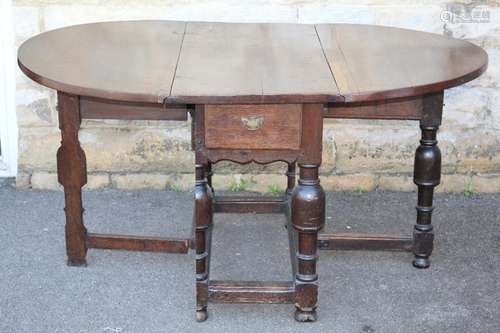 An 18th Century Country Gate Leg Dining Table, with two drawers, approx 107 x 55 x 77 cms