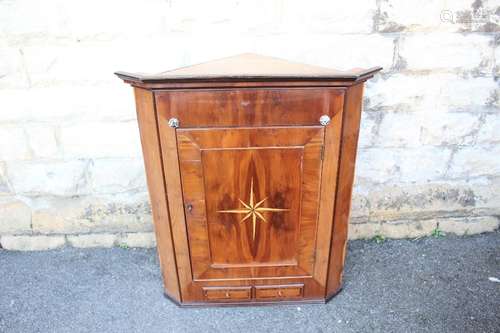 A Mahogany Corner Cupboard; the cupboard having decorative inlay on the door depicting a star, two inner shelves and two small drawers beneath, approx 78 x 45 x 92 cms