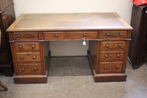 A Mahogany Desk; the desk having four drawers to each side with central drawer, brown tooled leather top, approx 152 x 83 x 77 cms