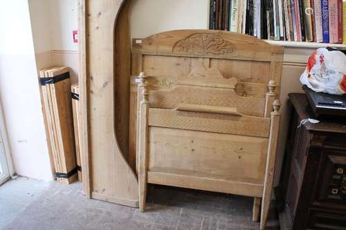 Two Vintage Pine Single Slat Beds; the beds with carving to head board, foot with finials