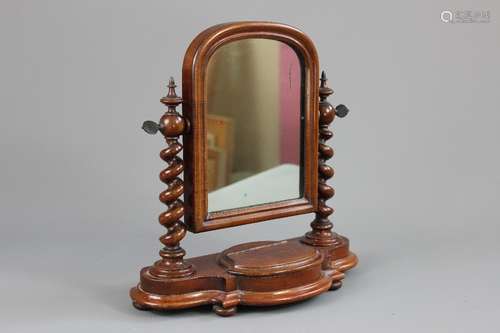 A Mahogany Apprentice Piece Vanity Mirror, with turned supports and a hinged cavity, approx 28 x 30 cms