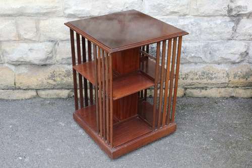 A Mahogany Revolving Bookcase; the bookcase on casters having one shelf on each side, approx 51 x 51 x 69 cms