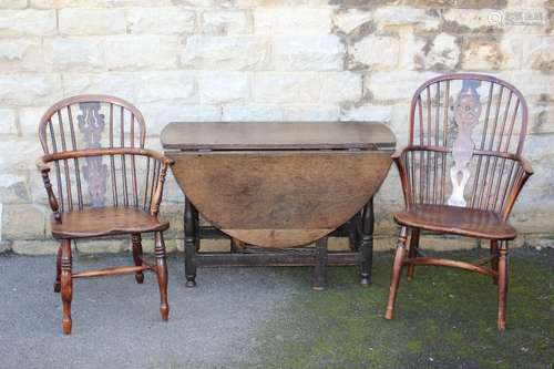 Antique Oak Drop Leaf Supper Table approx 108l x 145 w x 72 h cms together with four antique Windsor chairs (one with a damaged leg)