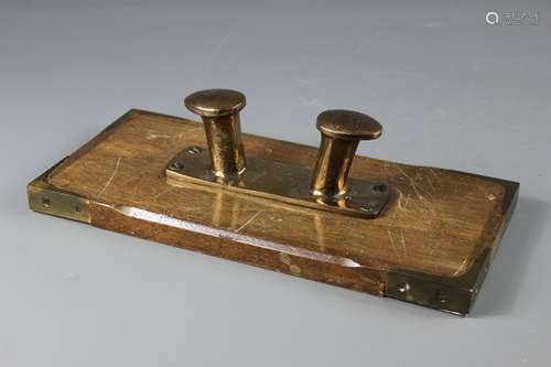 A Brass Yacht Mooring Bollard, mounted on an oak plaque to be used as a coat hooks, approx 32 w x 15 h cms