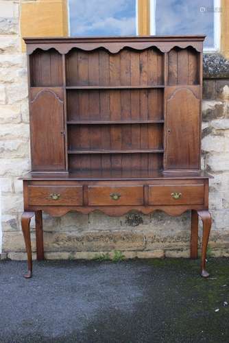 An Oak Dresser; the dresser having three shelves to top