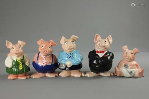 A Collection of Natwest Pig Money Boxes; the piggy money boxes depict a family of five