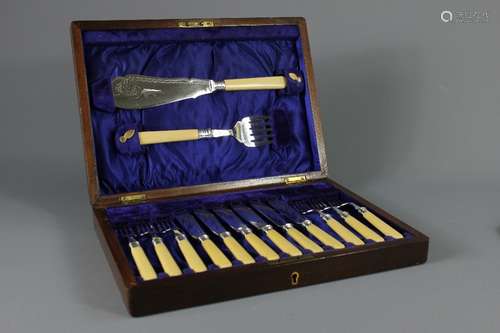 A Boxed Set of Six Fish Knives and Forks; with servers