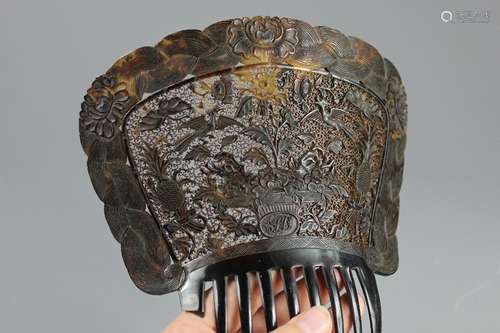 A Chinese Finely Carved Tortoiseshell Hair Comb, the intricate carving depicts a flowering urn to the centre with exotic birds and fruit to the outer edges, plaited border interspersed with peony, approx 19 cms w x 17