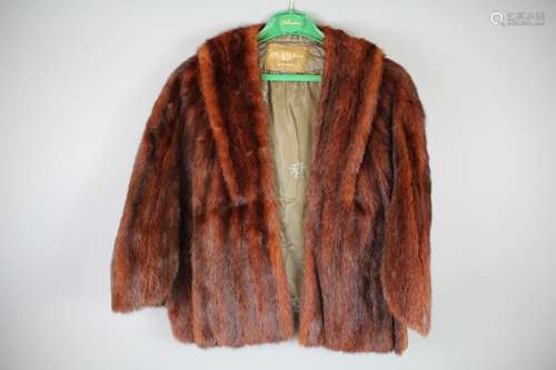 A Lady's Red Mink Short Cape, having a long collar terminating in pockets, size 14